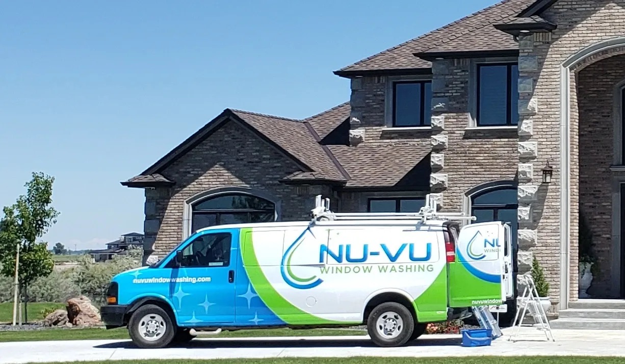 Nu-Vu Window Washing truck outside of a large home