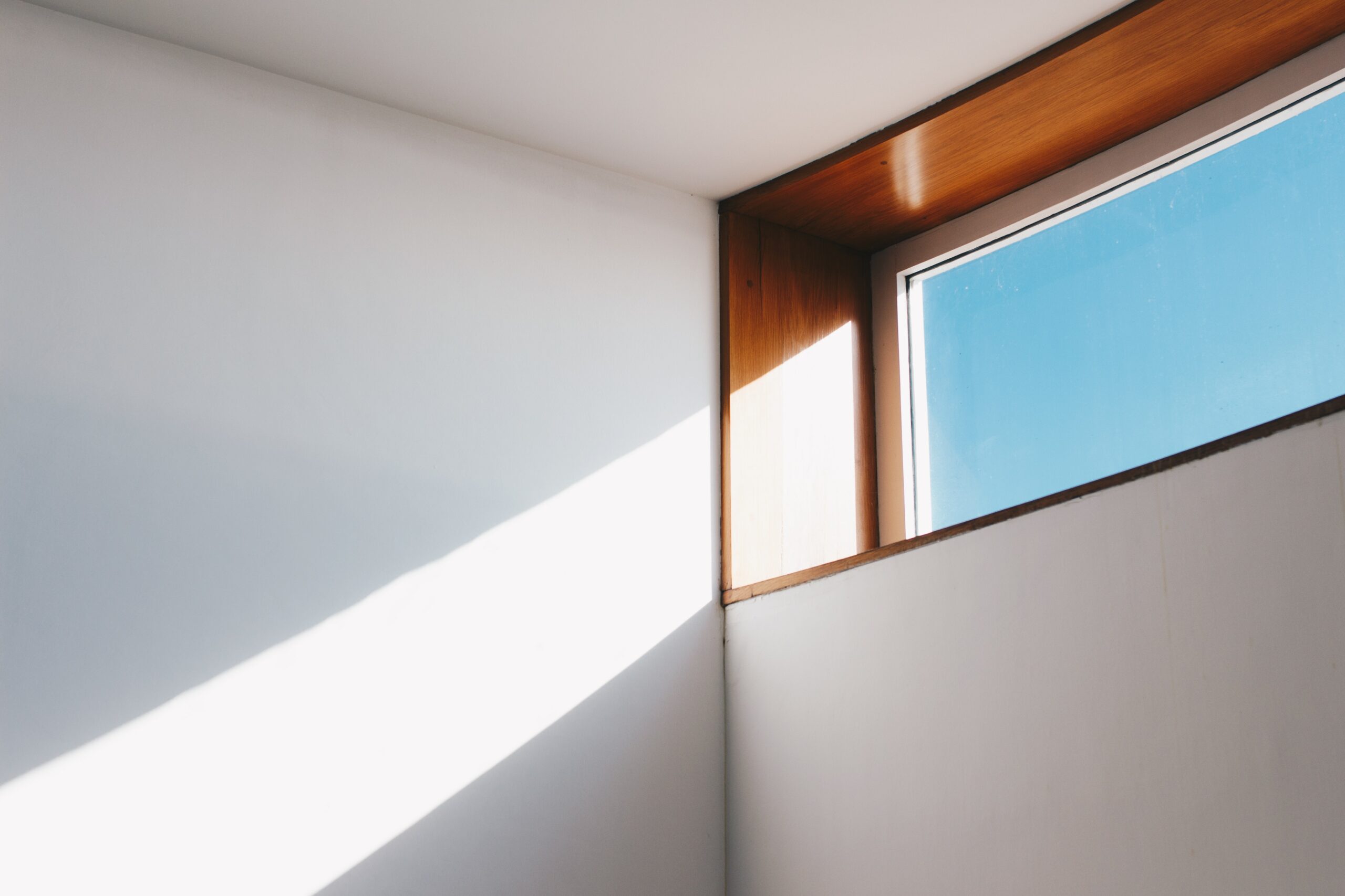 window of a home with sun shining through